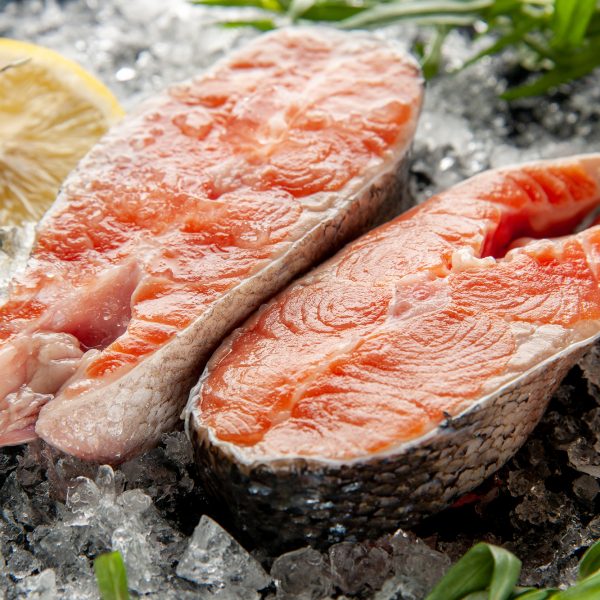 front close view fresh fish slices with lemon and ice on dark background photo color dish meat food darkness seafood